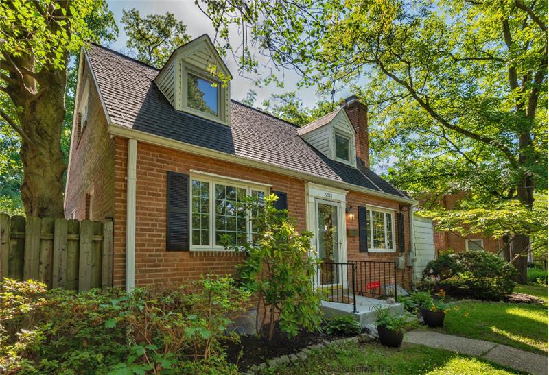 Charming Cape Cod with casement windows & dormers.