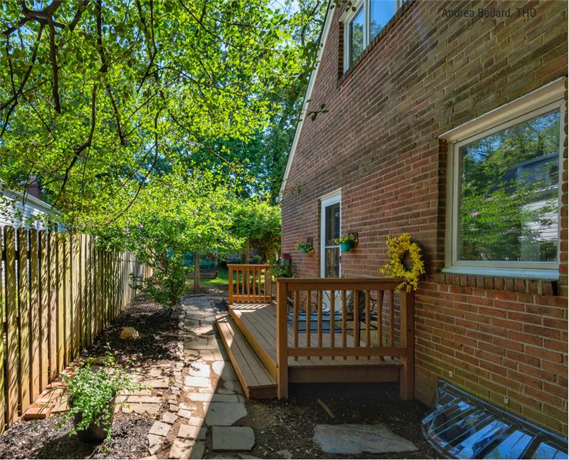 Access this quaint side porch from the kitchen.