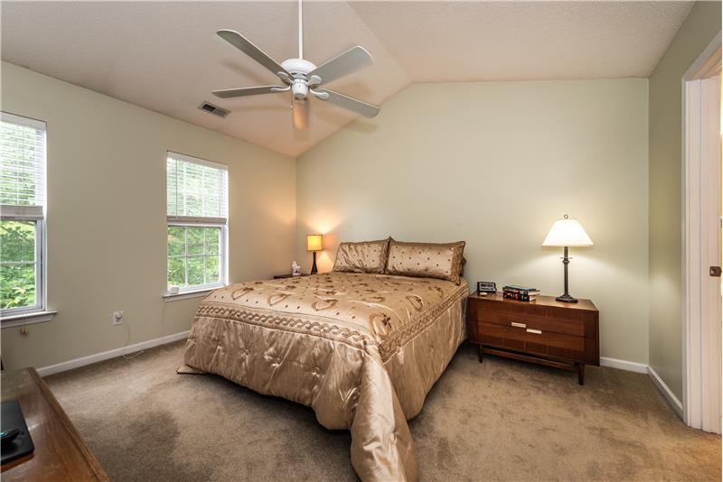 Spacious owner's suite with vaulted ceiling, walk-in closet.