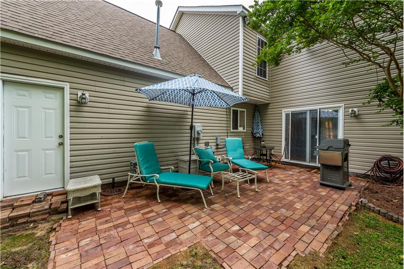 Bricked, private patio ideal for outdoor living and entertaining.