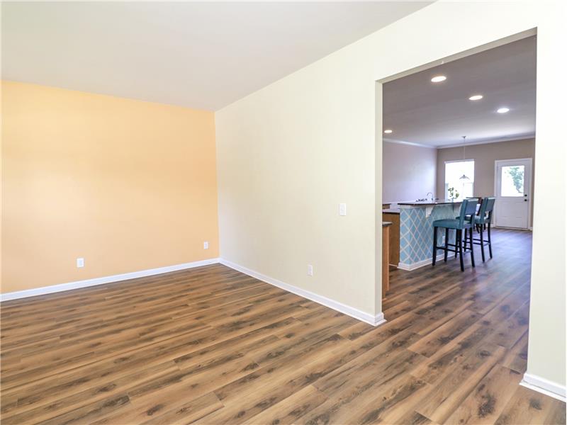 Beautiful wood-look vinyl plank flooring on main level