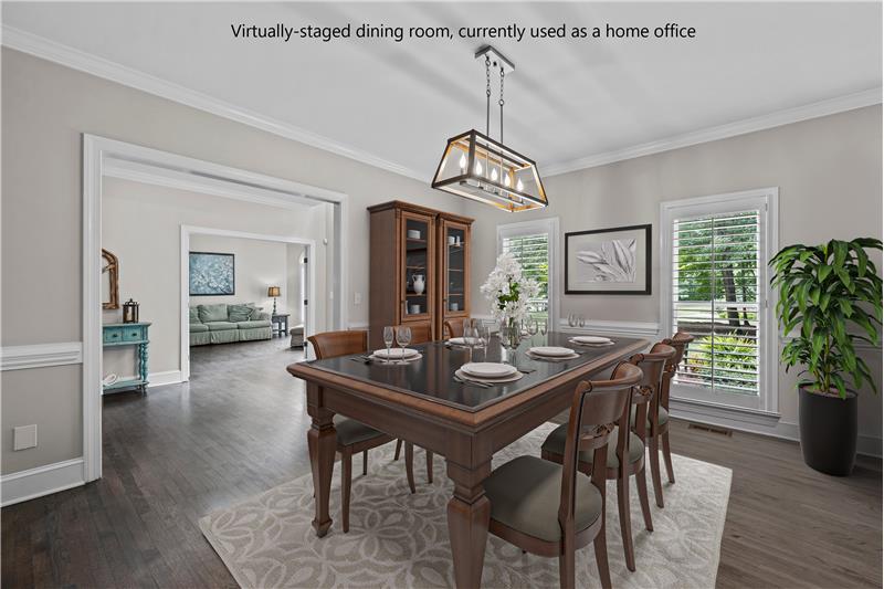 Virtually staged dining room currently used as a home office.