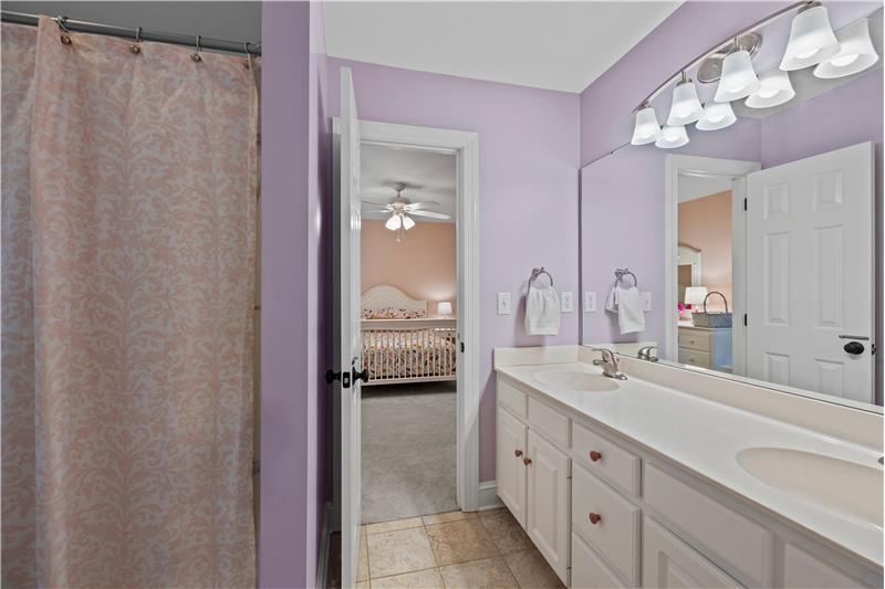 Jack & Jill bathroom shared by two of the homes secondary bedrooms.