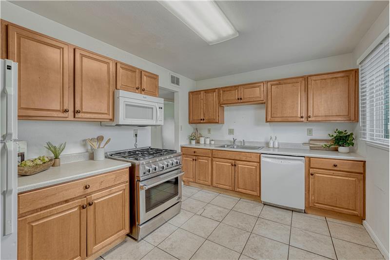 Updated kitchen with commercial grade gas range oven
