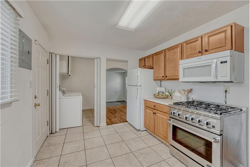 Laundry room is perfectly placed off of the kitchen