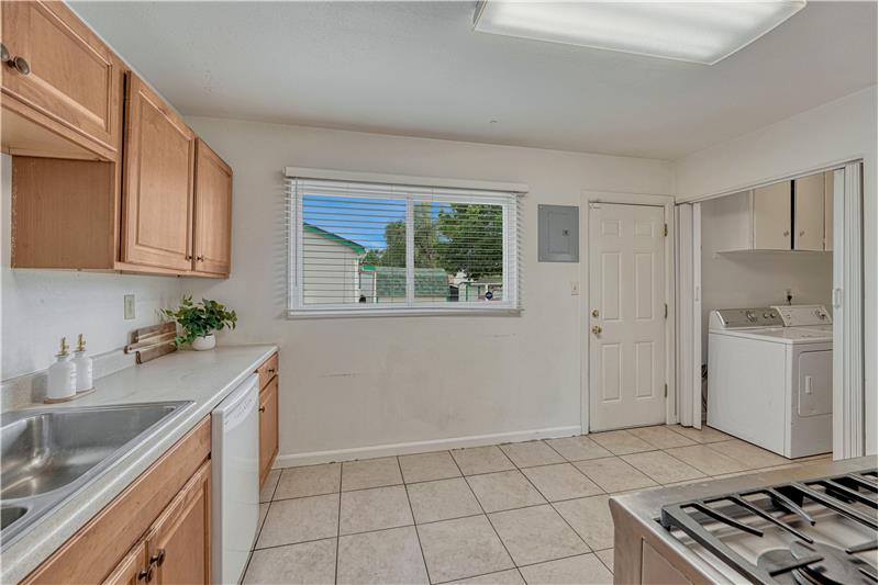 Kitchen has a large window and provides a walk out to the back porch
