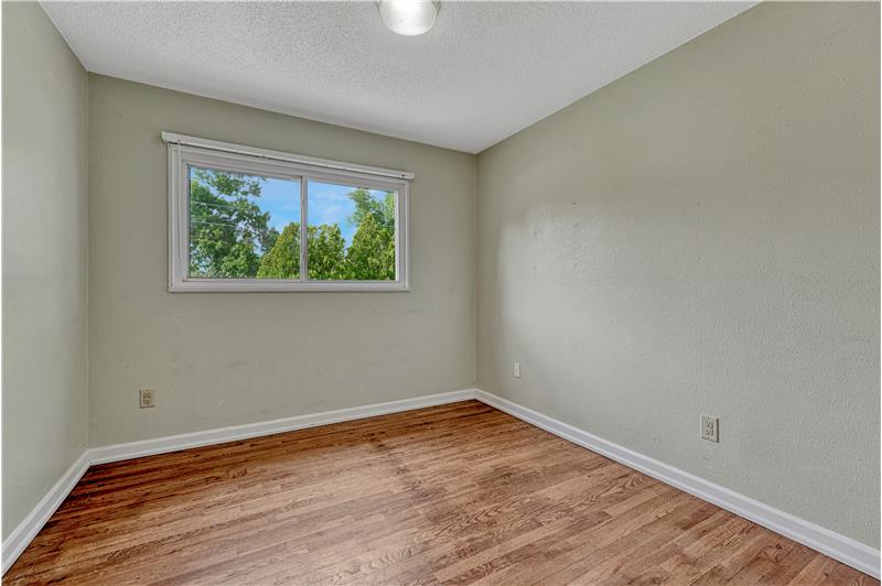 Bedroom #2 with hardwood flooring