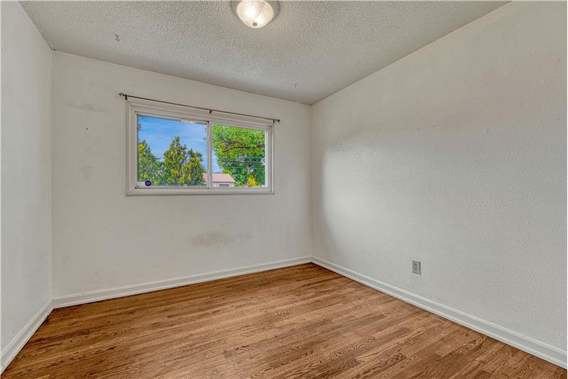 Bedroom #3 with hardwood flooring