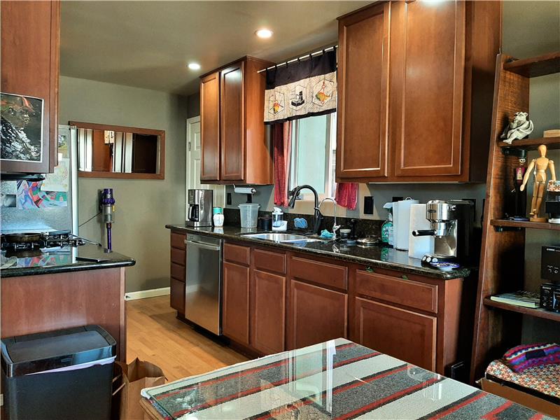 Granite Counters, Wood Cabinetry, Stainless Steel Appliances, New Faucets and Fixtures throughout!