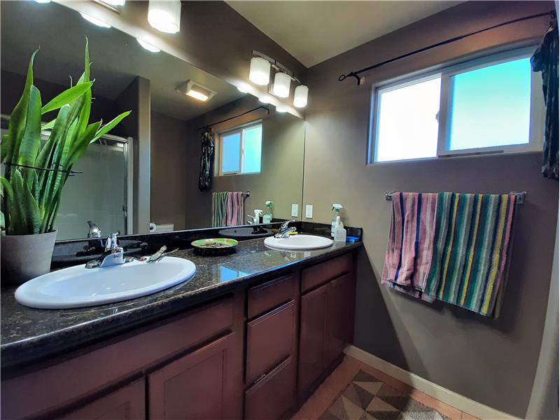 Master Bathroom with dual sinks and all the comfortable upgrades seen throughout the house.