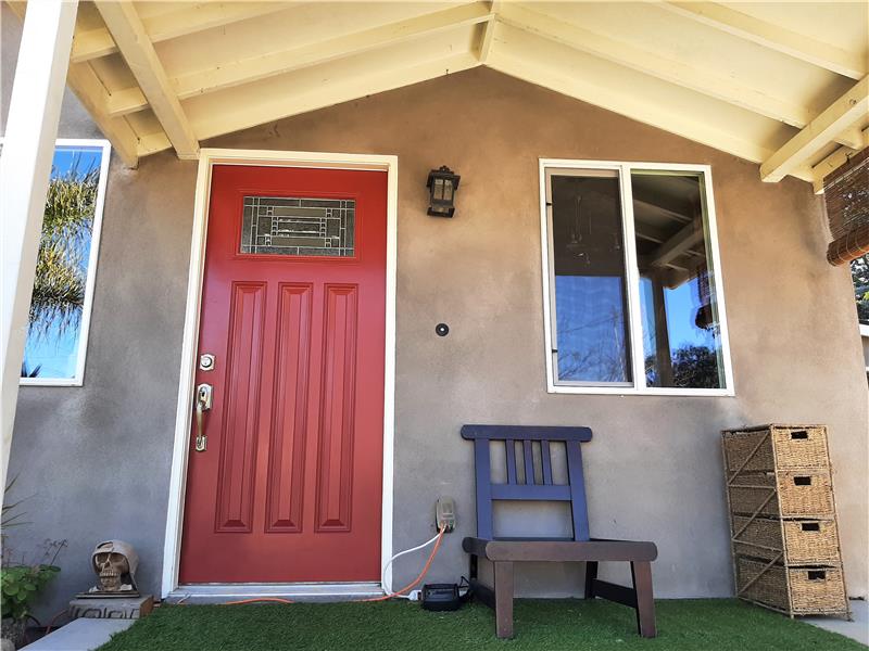 Welcome to 911 Dodson Way, home to the solid-core raised panel red door with etched glass and polished nickel hardware.