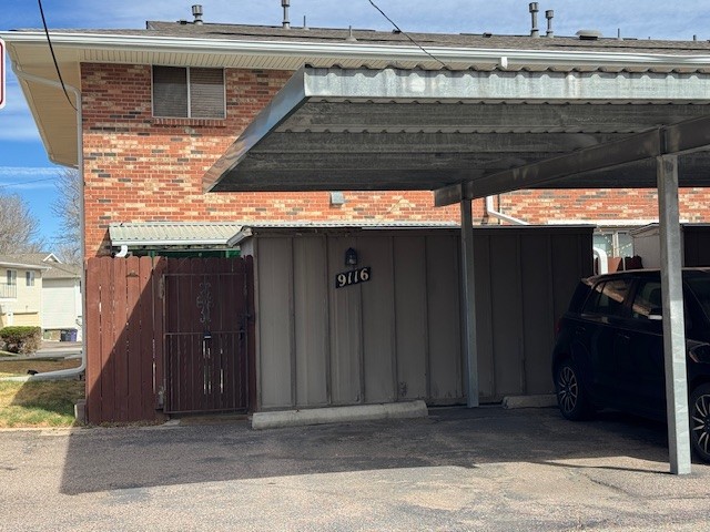 Patio and Shed are between unit and carport