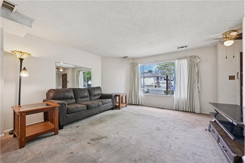 Behind the drywall on that diagonal wall is a fireplace you could uncover if wanted