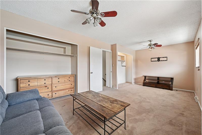 Reverse view of big bedroom. Notice the ceiling fans with lights for both former bedrooms