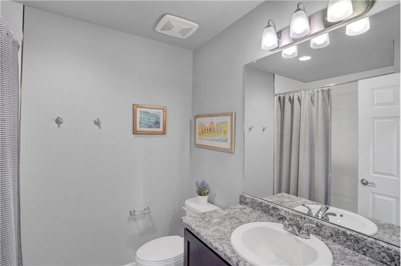 Upper Level Hall Bathroom with vanity and tiled tub/shower