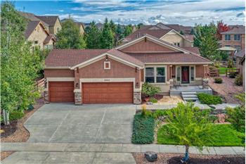 This beautifully appointed Vantage-built home offers 3BRs, 3BAs, and stunning Pikes Peak views from the front yard.