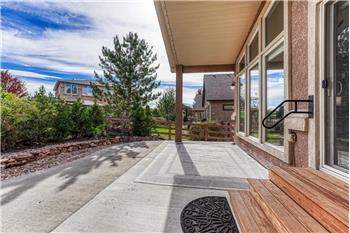 Slider from the Kitchen and also the Primary Bedroom to the partially covered backyard patio.