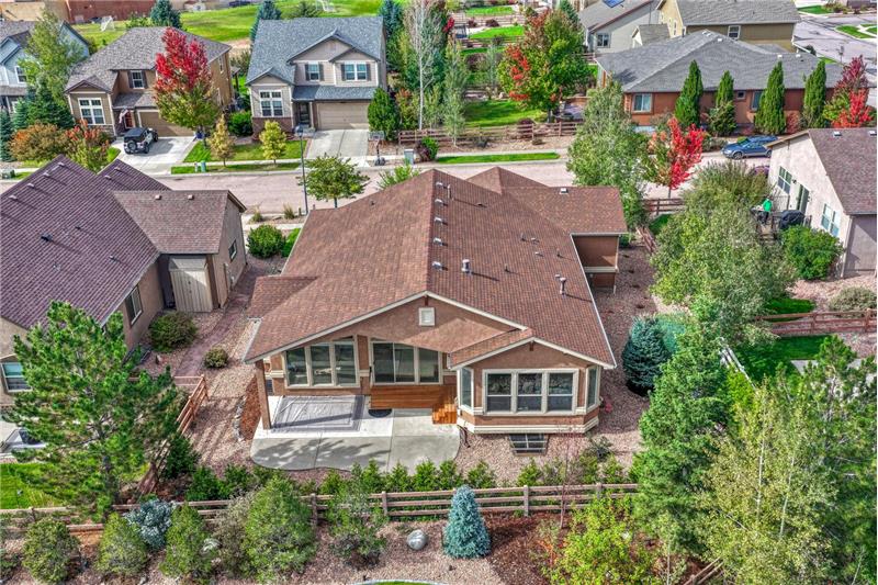 Aerial rear view of home and backyard.