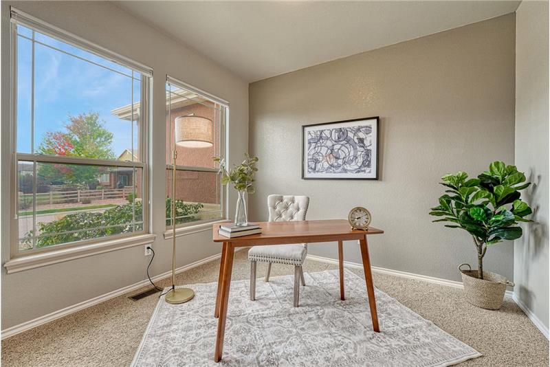 The versatile front room provides space for a home office, nursery, or guest area.