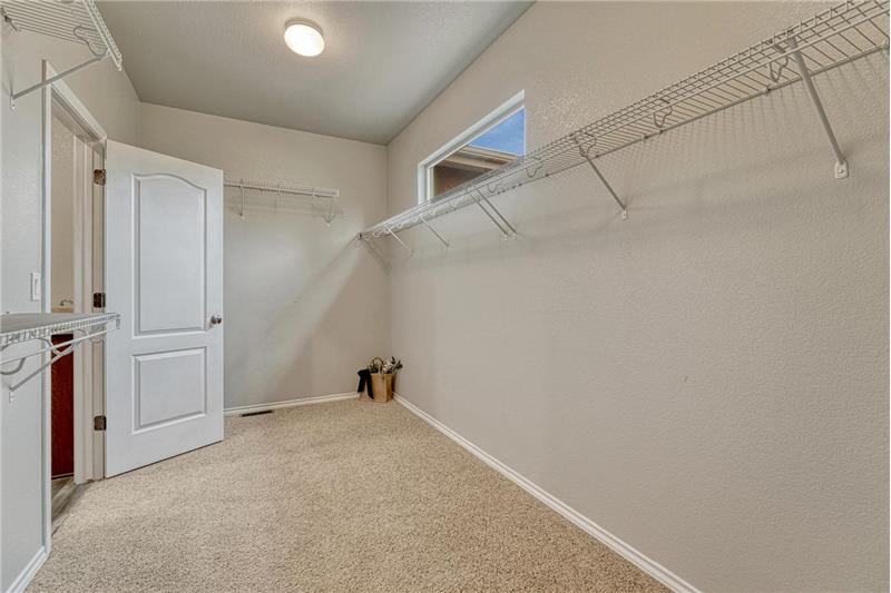 Primary Bedroom walk-in closet with direct access to the Laundry Room.
