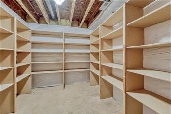 Basement Storage Room with built-in shelves.