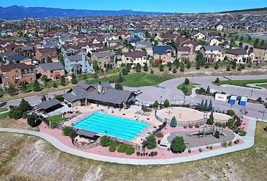 Aerial view of the Wolf Ranch Community Center, pool, and splash park.