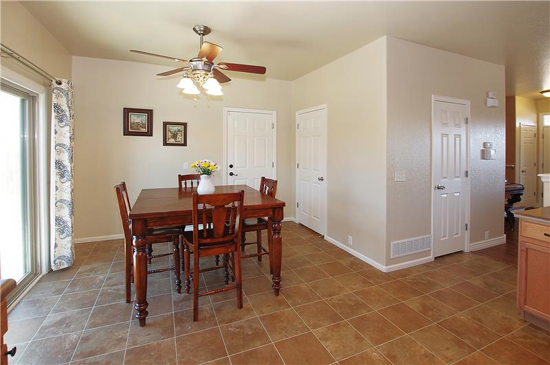 Dining area with ceiling fan