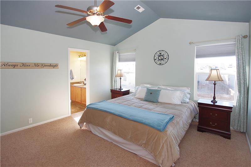 Accommodating master bedroom fits a King size bed