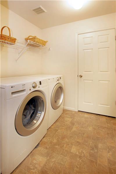 Upper level laundry room with large closet
