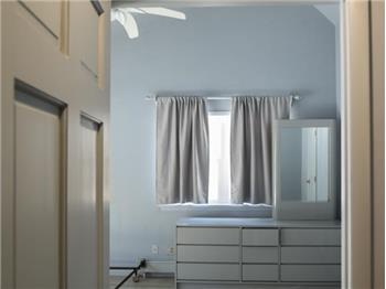 Bedroom with  vaulted ceiling and closet