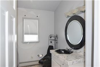 Marble top vanity and marble floor.