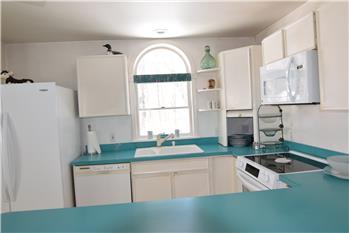 Oval window over the Kitchen sink