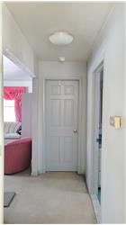 Hallway to first bedroom