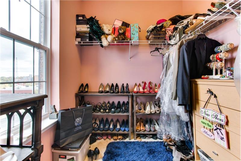 one of the two walk-in closets w. window