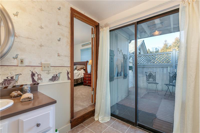 Master bath with view onto private deck