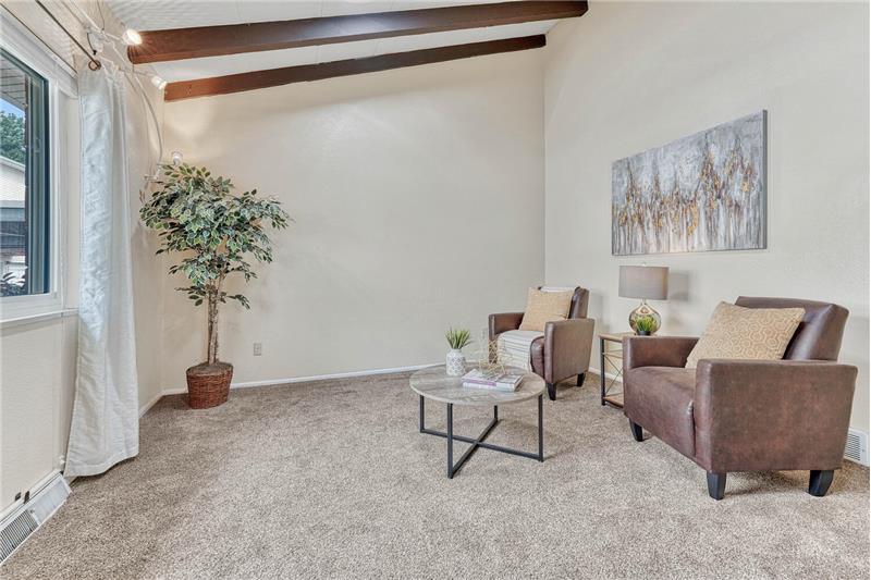 Bright living room with vaulted ceilings