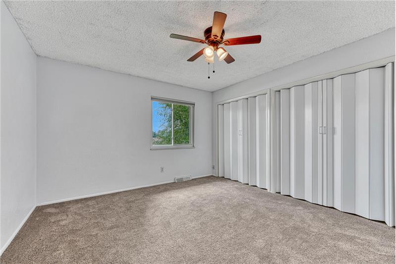Secondary bedroom on upper level with double closets!