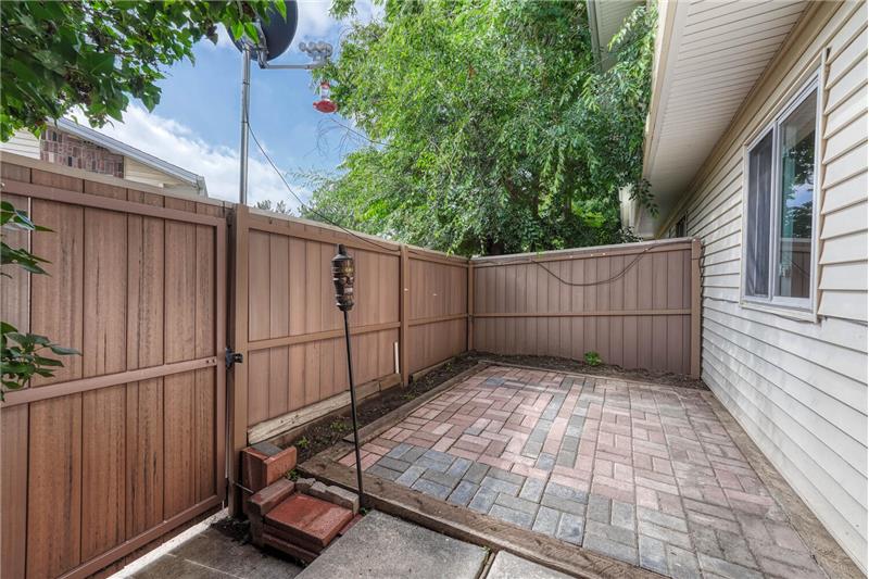 Secluded back patio area provides a gate that leads to community amenities
