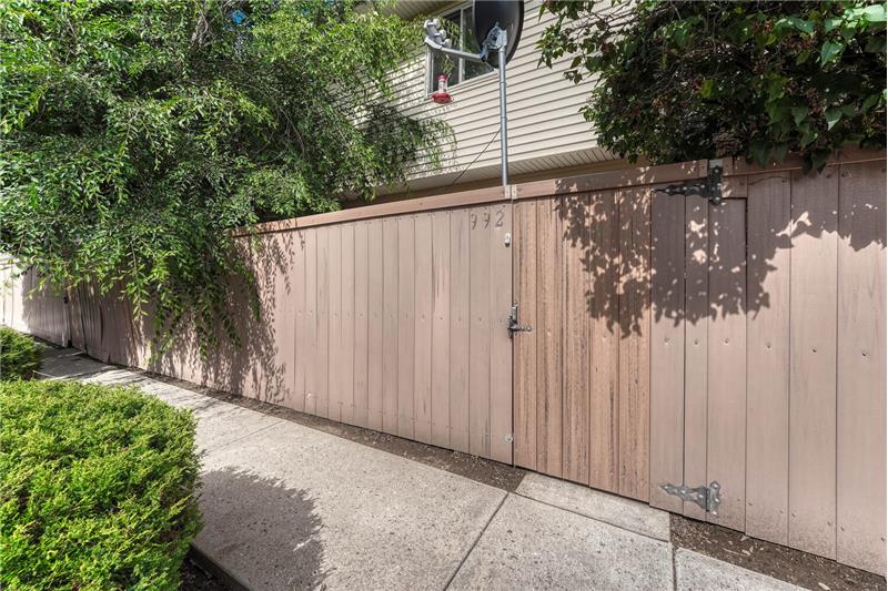 Rear view of patio area and gate