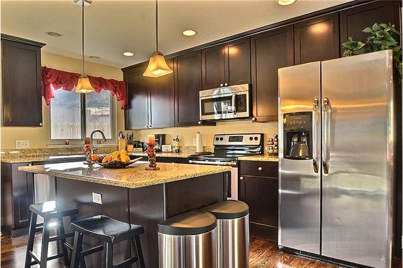 Kitchen & Breakfast Bar-Island, Granite Slab, Stainless Appliances & 42 inch Cabinets.