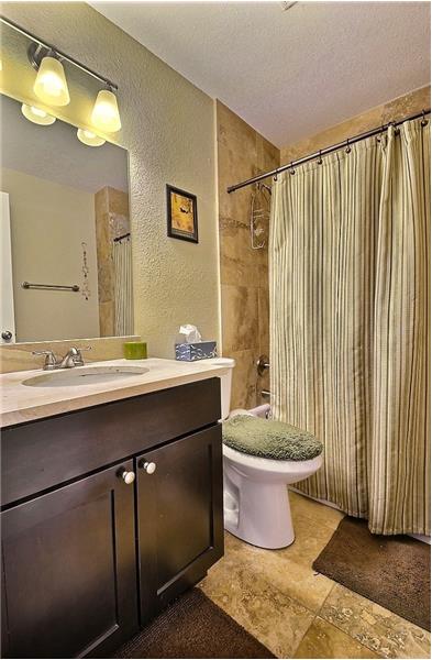 Main Level Full Bathroom - Tiled with High Quality Fixtures.