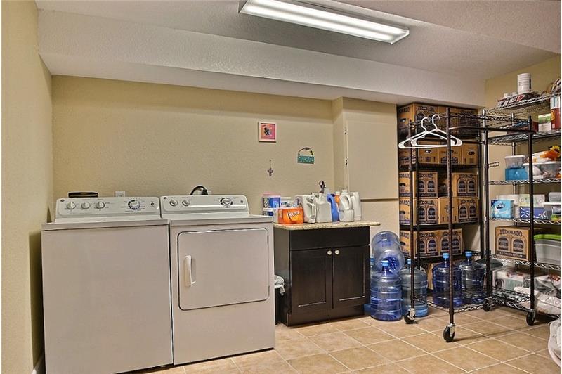 Large Basement Laundry Room - Tiled & Room for Storage.