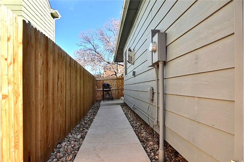 North Side Entrance with Small Patio - Home has New Wood Privacy Fencing