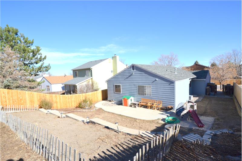 Back Yard Area and South Side Yard with Wood Shed at Entry Gate