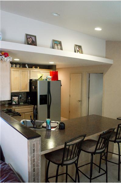 Kitchen has been updated with custom tile