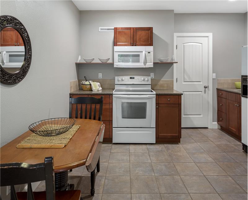 Kitchen with dining space on the lower level completes the MIL potential