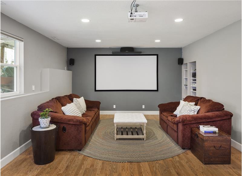 Bigger than it looks! You'll love this home theatre setup. 110-inch screen /w projection, fully wired surround system & receiver