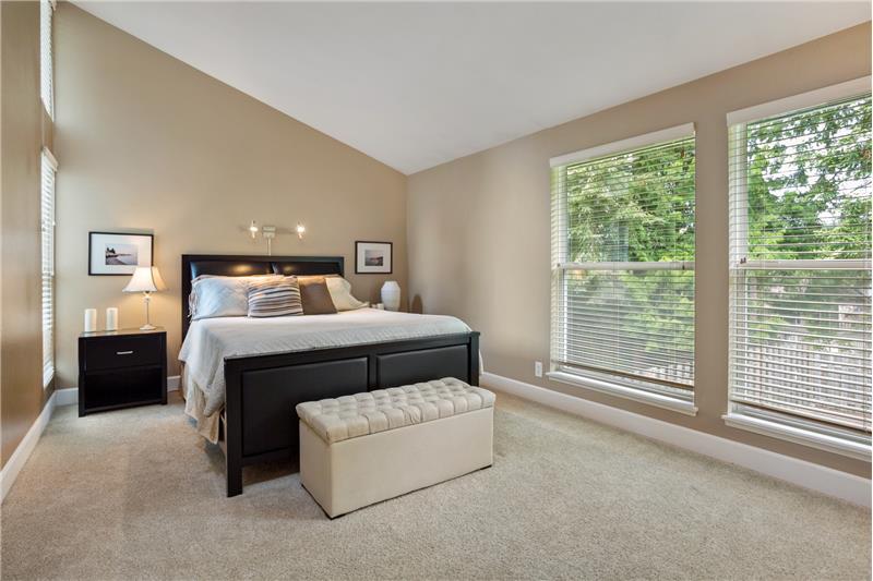 Vaulted Master Bedroom with large windows to provide ample daylight