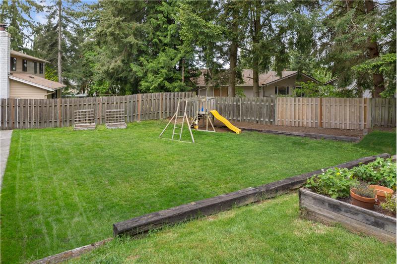 .29 acre fully lot with fully fenced back yard and raised garden beds