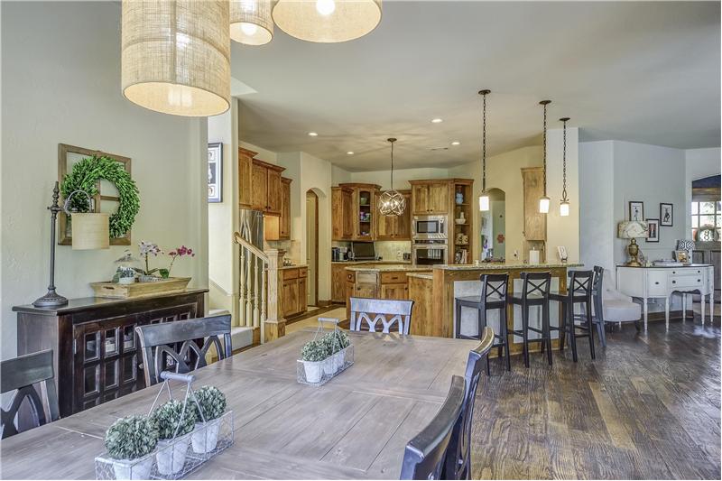 Spacious breakfast nook with unique light fixtures